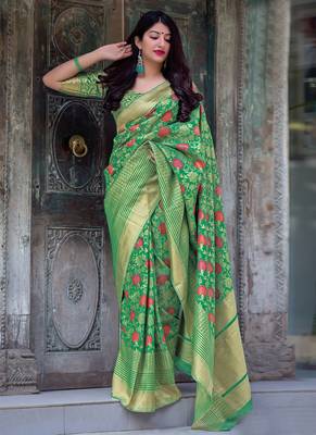 Green woven silk blend saree with blouse 1