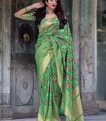 Green woven silk blend saree with blouse