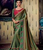 Green embroidered fancy fabric saree with blouse