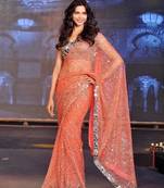 Orange embroidered georgette saree with blouse