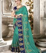 Teal Embroidered Fancy Fabric Saree With Blouse