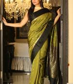 Dark green woven silk blend saree with blouse