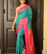 Turquoise woven silk blend saree with blouse