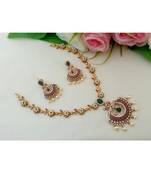 Eye Catching Matt Gold Finish Flower Design Necklace With Peacock Pendant & Matching Ear Rings