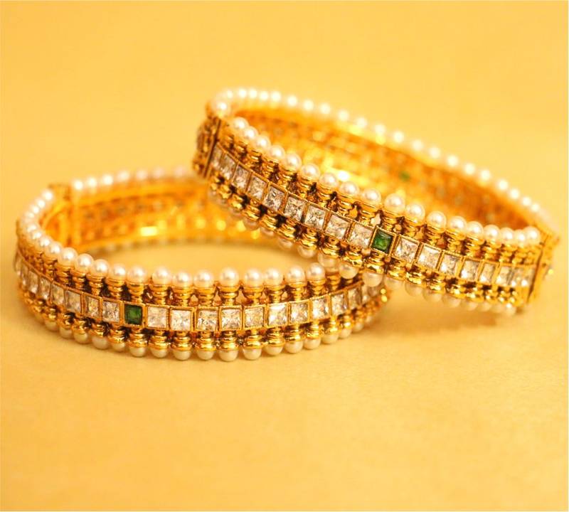 Gold zircon banglesandbracelets Sanvi Jewels Pvt. Ltd. 438323