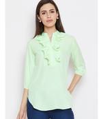 neon green crepe tunic with ruffles at neck