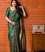Dark green woven banarasi silk saree with blouse