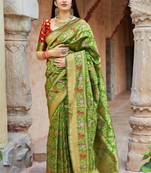 Green woven banarasi silk saree with blouse