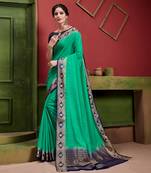 Green woven Silk blend saree with blouse