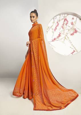 Orange woven georgette saree with blouse 1