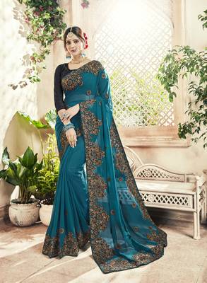 Teal embroidered georgette saree with blouse 1