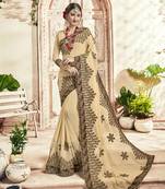 Cream embroidered georgette saree with blouse