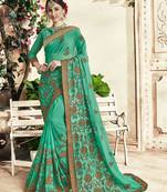 Sea green embroidered georgette saree with blouse