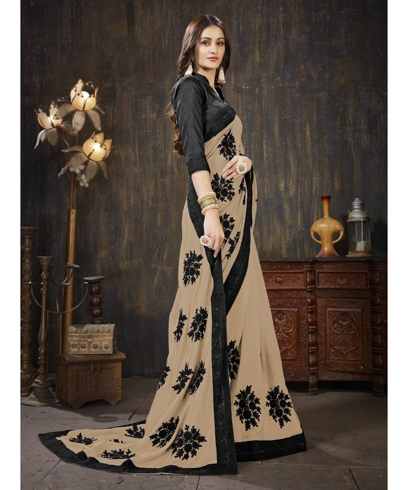 Beige embroidered georgette saree with blouse