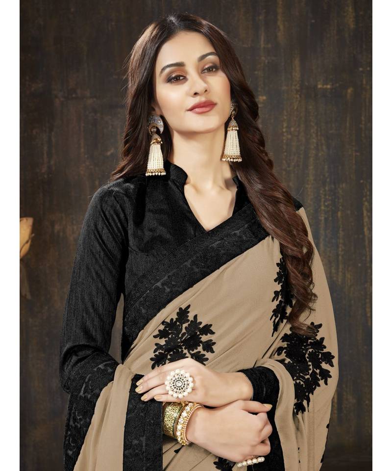 Beige embroidered georgette saree with blouse
