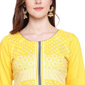 Yellow printed rayon kurtas-and-kurtis 5