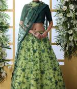 Florence Green Thread Embroidered Work With Stone Pasting Net Semi Stitched Bridal Lehenga