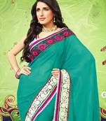 Dark green embroidered georgette saree with blouse