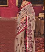 Beige embroidered georgette saree with blouse