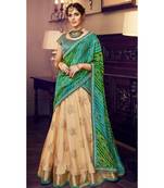 Tussar Color Net Lehenga With Green Handloom Choli And Green Bandhani Colour Georgette Dupatta