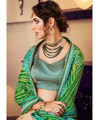Tussar Color Net Lehenga With Green Handloom Choli And Green Bandhani Colour Georgette Dupatta 4