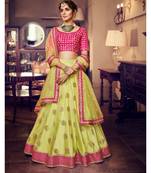Lirill Green Colour Net Lehenga With Rani Colour Handloom Silk Choli And Lirill Green Colour Net Dupatta