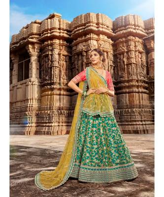 Ferozi Colour Jacquard Lehenga With Rani Colour Jacquard Choli And Yellow Colour Net Dupatta 1