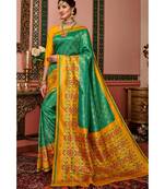 Green woven blended silk kanjivaram saree with blouse