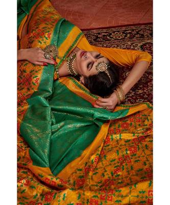 Green woven blended silk kanjivaram saree with blouse 2