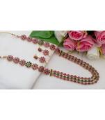 Mezmerising Antique Gold Tone Flower Design Long Neck Wear Made Out From Ruby & Emerald Stones With Matching Ear Rings