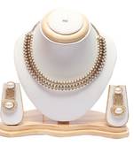Beautiful intricately carved pearl earrings with choker necklace