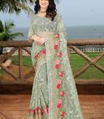 green embroidered net saree with blouse