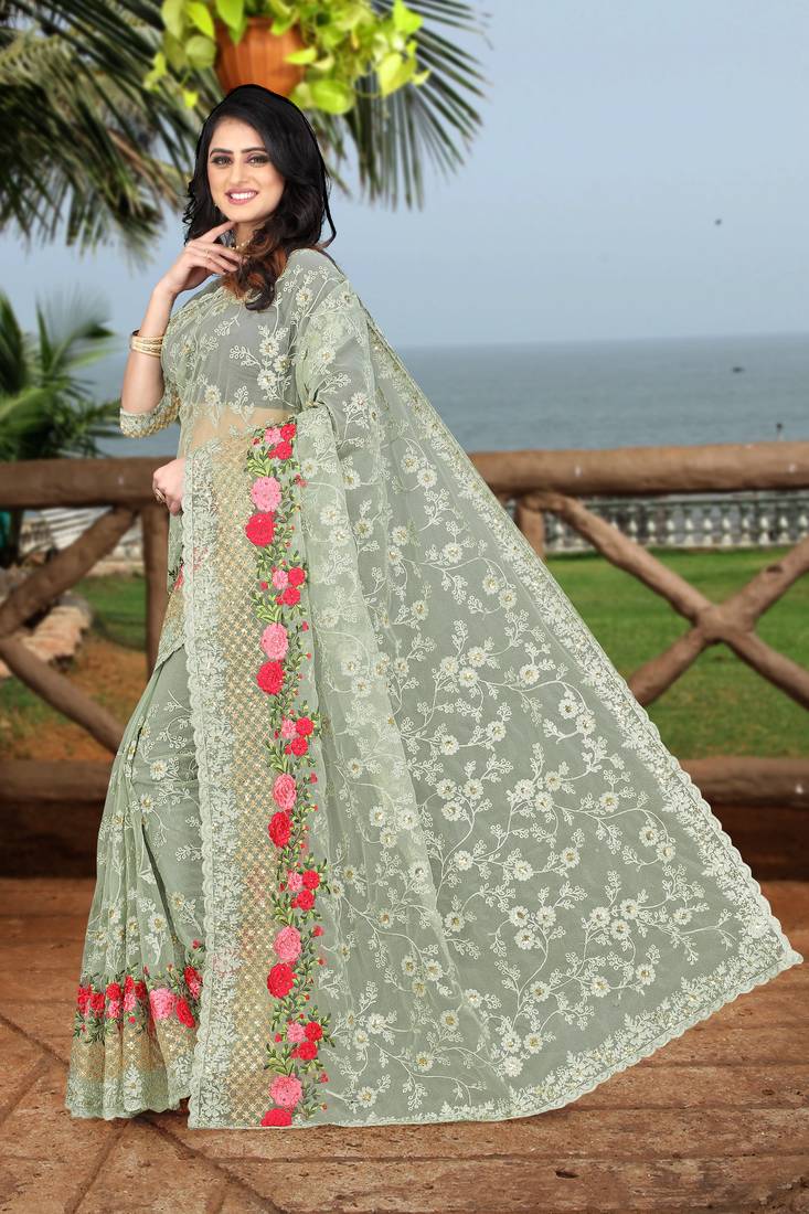 green embroidered net saree with blouse