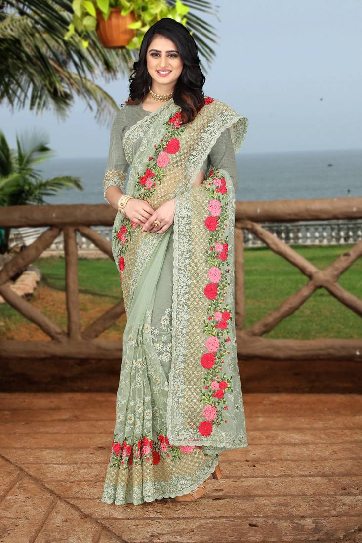 green embroidered net saree with blouse