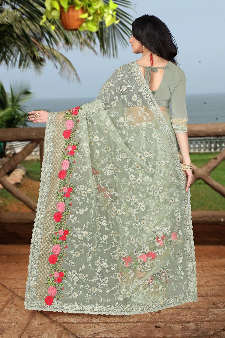 green embroidered net saree with blouse