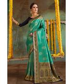 Teal green woven Banarasi Kataan saree with blouse