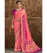 Peach pink woven Banarasi Kataan saree with blouse