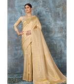 Subtle gold woven kanjivaram saree with blouse