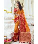 Mustard yellow designer banarasi saree with embroidered silk blouse
