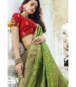 Pastel green woven designer banarasi saree with embroidered silk blouse