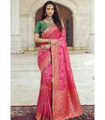 Pastel pink woven designer banarasi saree with embroidered silk blouse