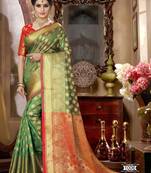 Green woven silk blend saree with blouse