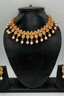 Women Gold-Plated Pink & Green Stone Studded Handcrafted Temple Jewellery Set