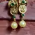 Women Gold-Plated Pink & Green Stone Studded Handcrafted Temple Jewellery Set