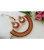 Beautiful Matt Gold Finish Neckset With Ruby Emerald Stones And Pair Of Matching Ear Rings