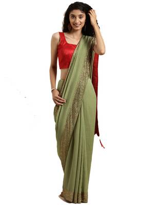 Green woven silk blend saree with blouse 1