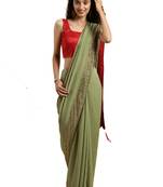 Green woven silk blend saree with blouse