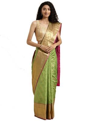 Green woven silk blend saree with blouse 1