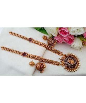 Gorgeous Matt Gold Finish Long Haar with Real Kemp Stone Lakshmi Pendant and Matching Jhumkas 1