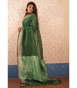 Bottle Green Linen saree with blouse with Zari Border